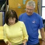 Boise Philharmonic team members Margaret Janzen and Mike Winter participate
in the bronze and mold making process 