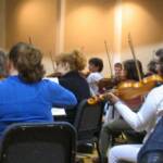 Boise Philharmonic string section during rehersal